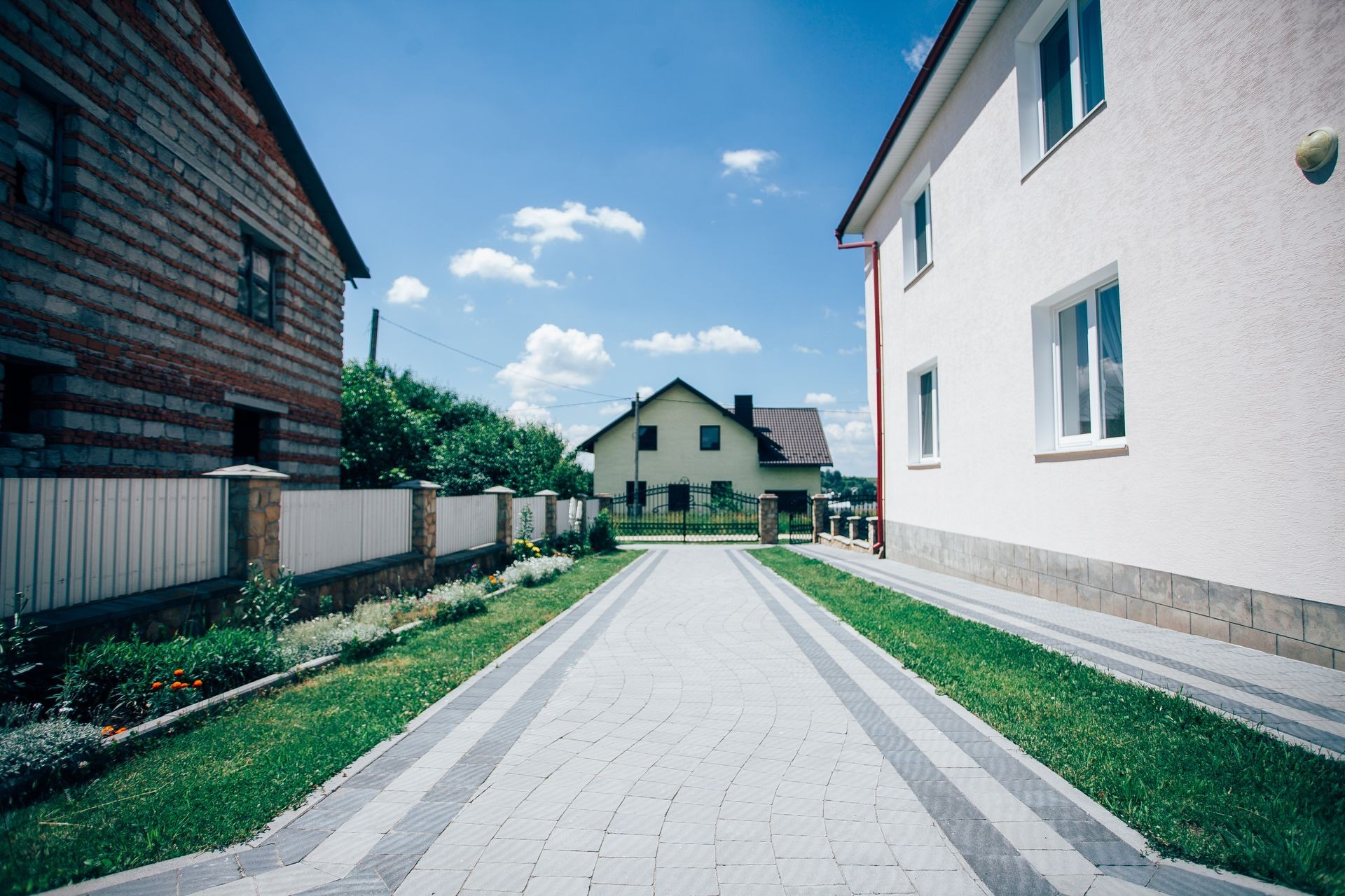 Perspective View of Monotone Gray Brick Stone on The Ground for Street Road. Sidewalk, Driveway, Pavers, Pavement in Vintage Design Flooring Square Pattern Texture Background, house, grass Perspective View of Monotone Gray Brick Stone on The Ground for Street Road. Sidewalk, Driveway, Pavers, Pavement in Vintage Design Flooring Square Pattern Texture Background, house, grass